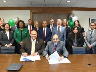 Photo of President Riverso and Columbia exchange students and faculty