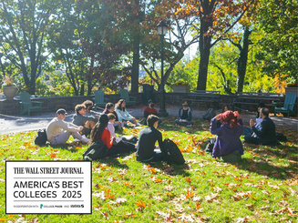 Students sitting on the quad with the Wall Street Journal College Rankings logo