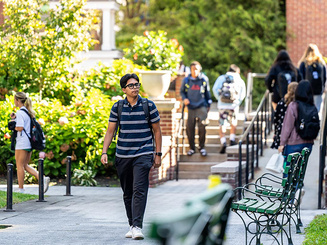 Image of students walking on the campus of Manhattan University