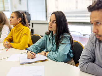 group of students sitting in a classroom