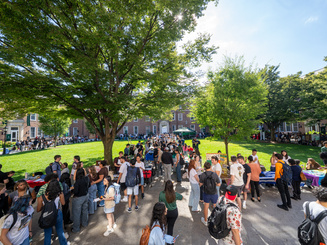 Manhattan University students on the Quad in the summer.