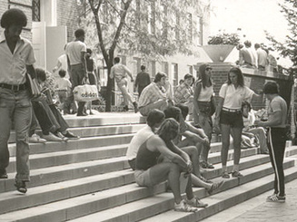 Students gather and socialize on campus steps at Manhattan College shortly after the university became coeducational in the 1970s.