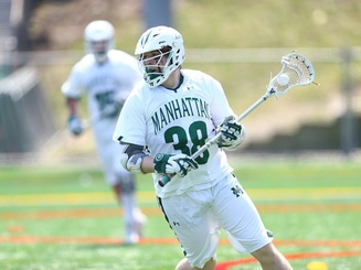 lacrosse player in full gear on a playing field