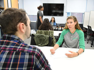 a student meets with an advisor to talk about financial aid