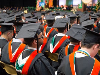 graduates seated at commencement