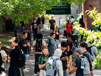 Manhattan University students walking on campus