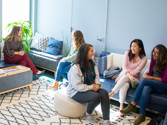 women talking inside the women's center