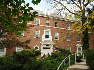 brick exterior of Chrystostom Hall on the campus of Manhattan University