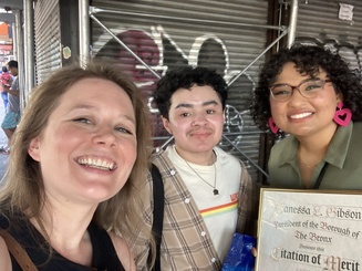 three pride center members pose for a photo togther