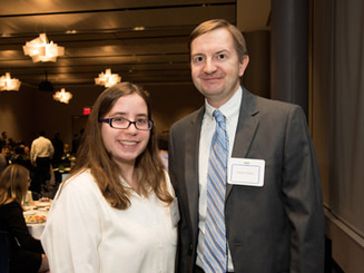 a student and mentor at a mentor dinner event