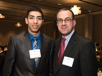 a student and mentor at a mentor dinner event