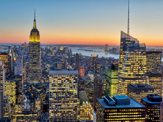 view of new york city skyscrapers at sunset