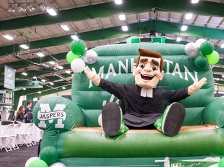 Jasper mascot sitting on a big inflated chair