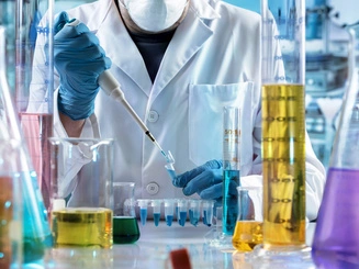 Chemical engineering graduate students working in a lab