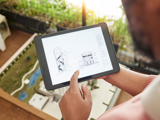 Engineers are designing houses for architectural projects. engineering tools at work Architects calculate and draft building construction drawings, civil engineering, architect concepts. 