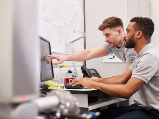 Male Engineers Use CMM Coordinate Measuring Machine In Factory