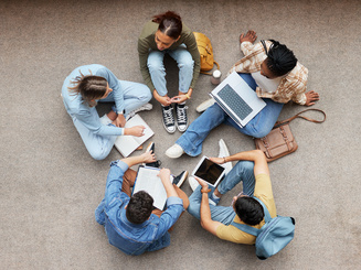 Group of Manhattan University students sitting in a circle