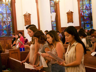 students attend mass at Manhattan University
