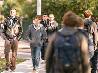 students walk on campus for orientation