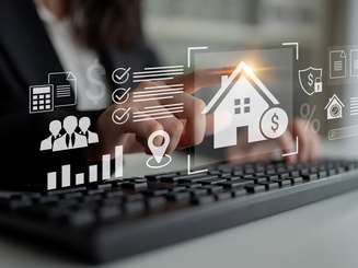 Graphic showing charts and a house next to someone typing on a keyboard