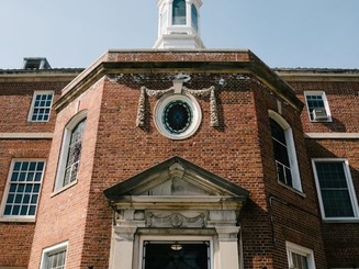 brown brick facade of Manhattan University administrative building
