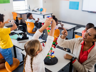 Teacher giving lesson to her students