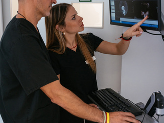 Healthcare professionals analyzing patient x-ray scan for diagnosis