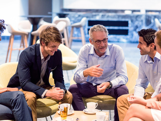Business people having a discussion in cafeteria