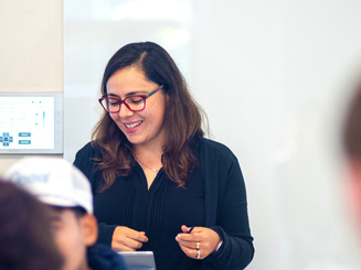 Manhattan University professor in business class teaching