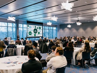 An image of a captive audience at Manhattan University listening to an ARCHtalk speaker.