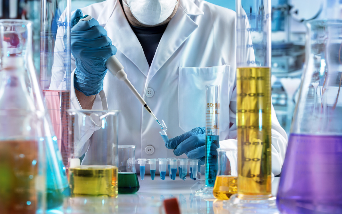 chemical engineer working in the research laboratory / researcher holding test tube with chemist material in the investigation lab