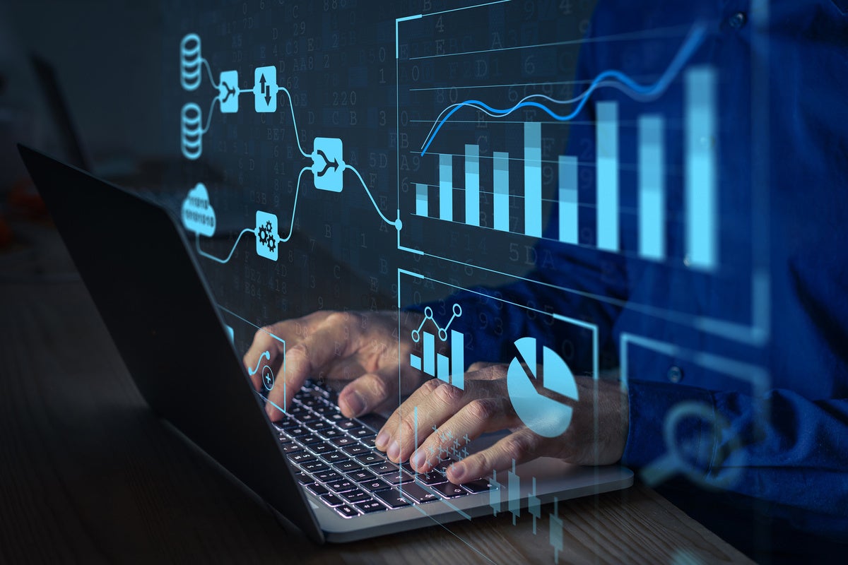 Analyst working with Business Analytics and Data Management System on computer to make report with KPI and metrics connected to database.