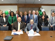 Photo of President Riverso and Columbia exchange students and faculty