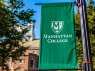 Manhattan College flag on campus in the quad