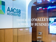O'Malley School of Business door and AACSB accreditation sign