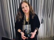 Photo of Mehnaz Afridi with the In Concert Against Hate Award