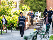 Image of students walking on the campus of Manhattan University
