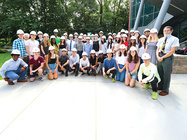 Image of Walter Saukin, Ph.D. and engineering students standing together on campus.