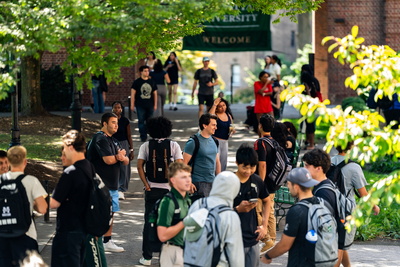 Group of students walking through the quad at Manhattan University