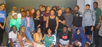 students gather in a group for a photo