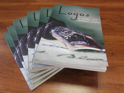 A stack of Logos publications on a table
