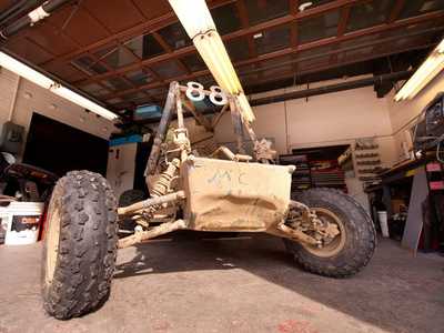 a baja vehicle in a garage