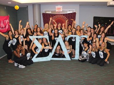 members of the Sigma Delta Tau sorority pose for a group photo