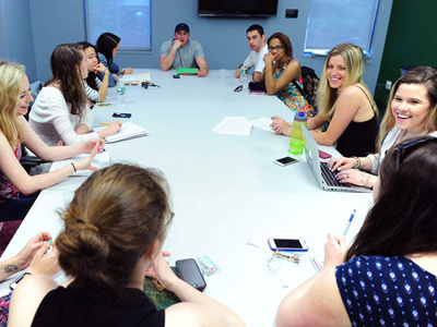 members of students government meet around a table