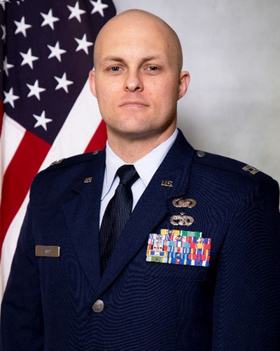 Official portrait of Capt. Ryan Smith, Assistant Professor of Aerospace Studies at AFROTC Detachment 560, in U.S. Air Force dress uniform.