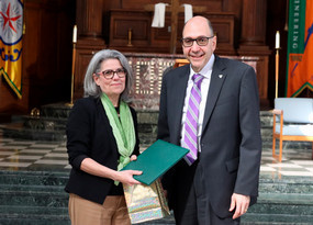 Barbara Herlihy shaking hands with former MU president Dr. Milo Riverso