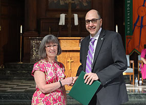 Deborah Pitula shaking hands with former MU president Dr. Milo Riverso