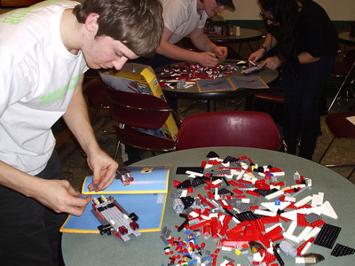 a student builds a lego set