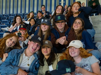 students and family attend a Yankees game