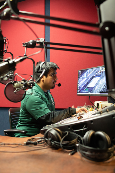 Manhattan University in a sound booth, working on a class exercise